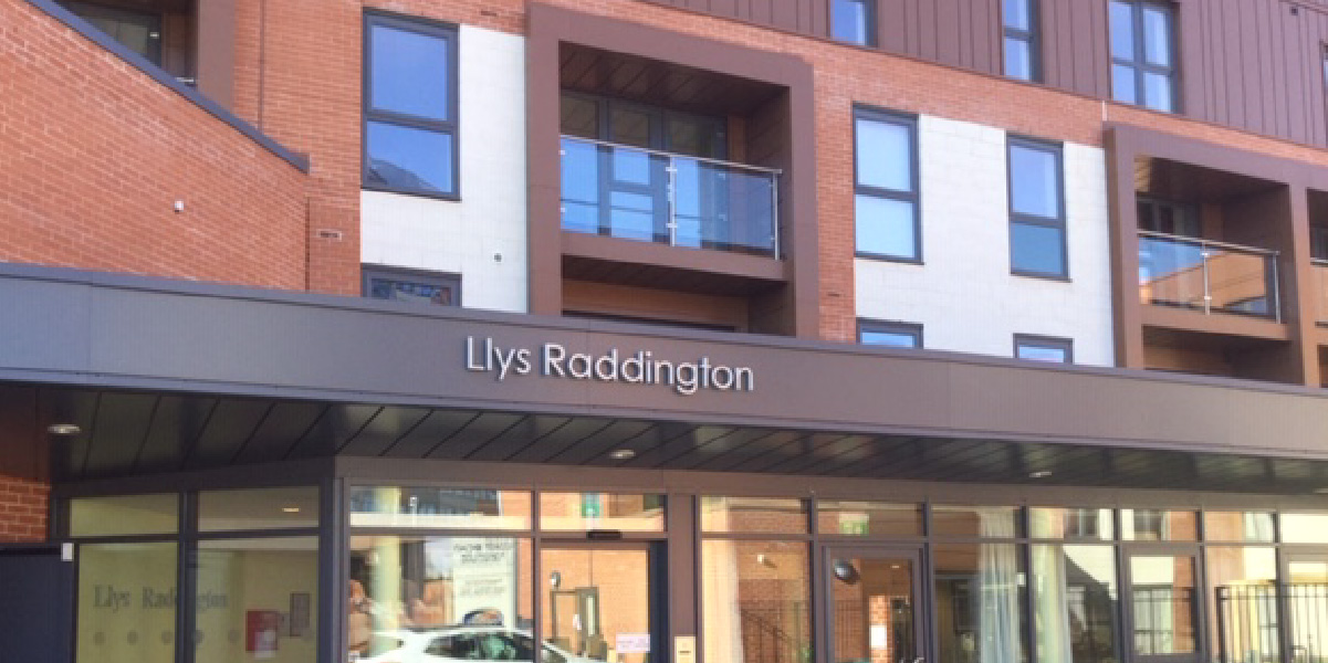 External stainless steel building sign at Llys Raddington
